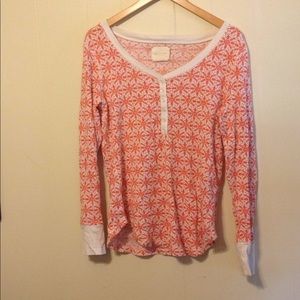 VS snowflake print thermal top. Orange and white.
